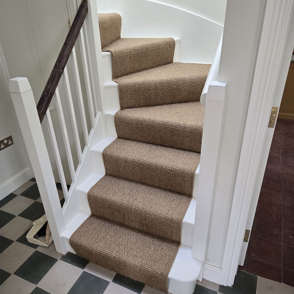 Sisal stair carpet with winders and a bullnose bottom step